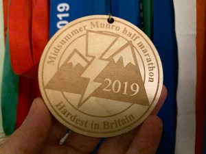 Photo of a wooden medal for the 2019 Midsummer Munro