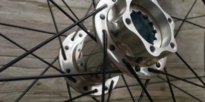 Photo of a silver Chris King mountain bike hub for a Cannondale Lefty Max fork
