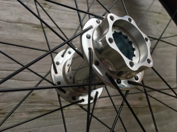 Photo of a silver Chris King mountain bike hub for a Cannondale Lefty Max fork